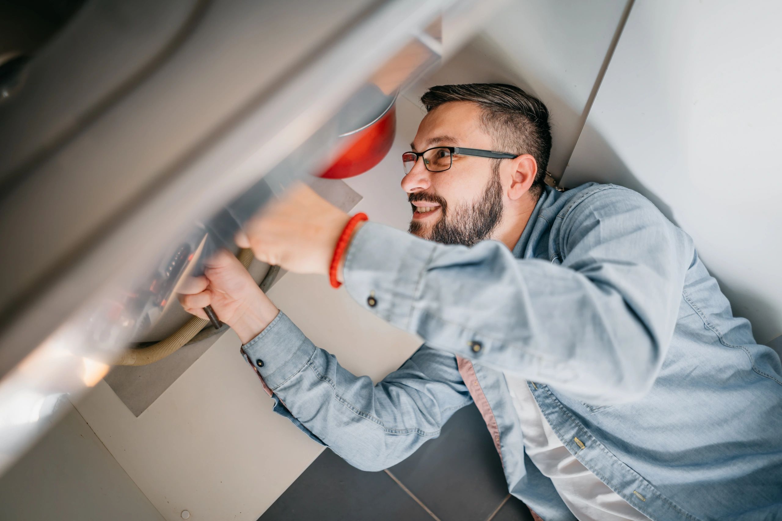 Plumber working on a residential water heater