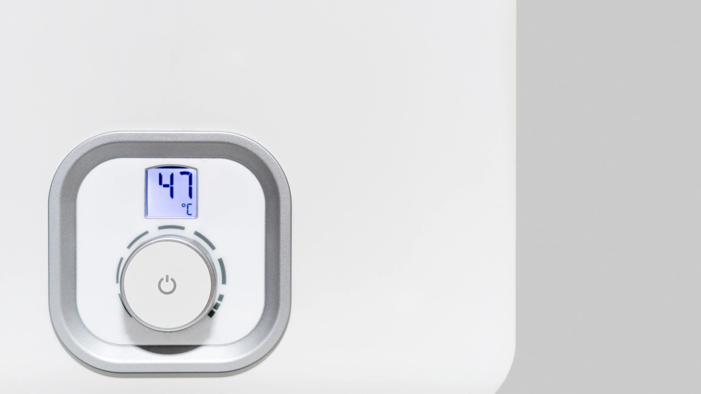 Close-up of a modern water heater control panel