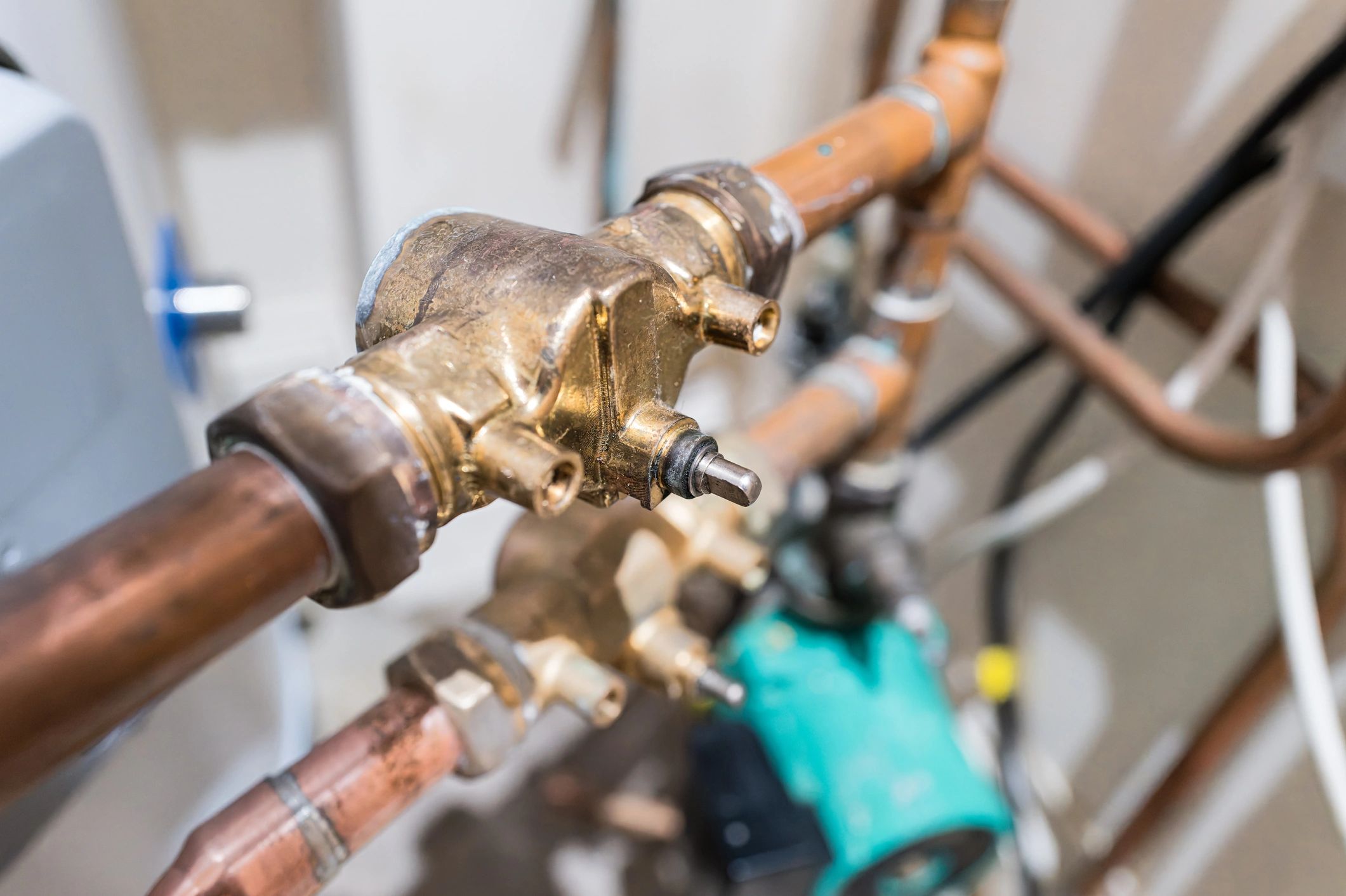 Close-up of a newly installed copper valve in a heating system